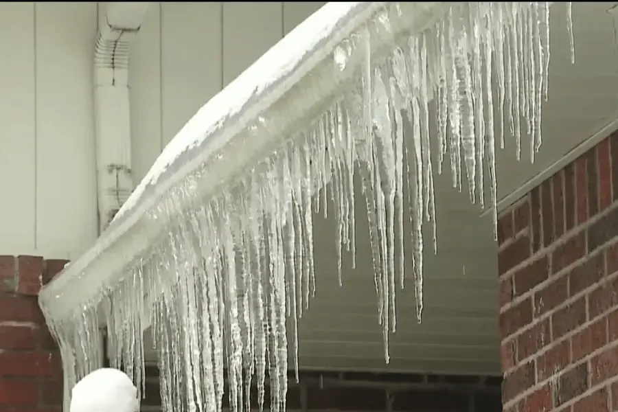 Ice collected along the edge of a gutter